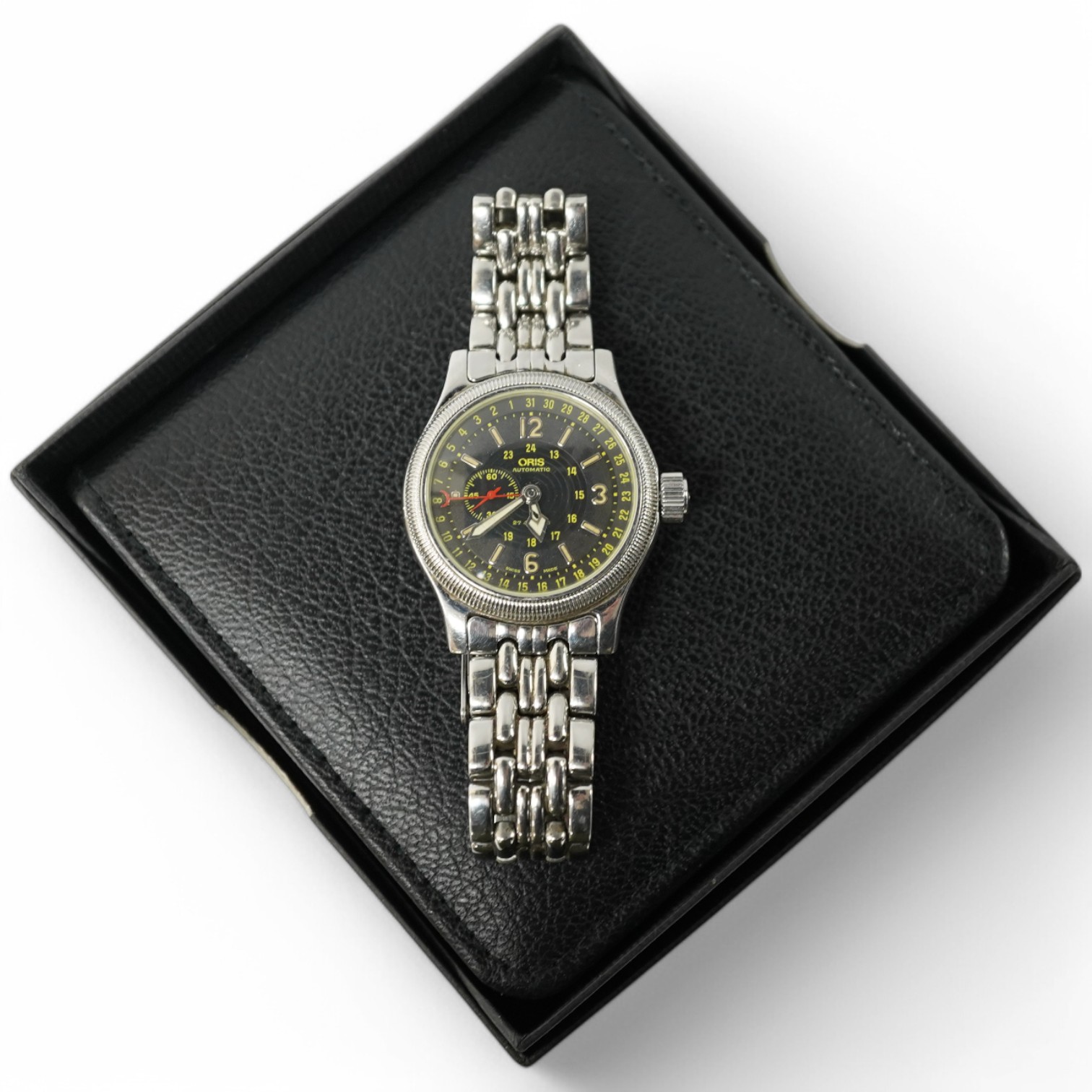 A gentleman's recent stainless steel Oris 640 Automatic wrist watch, with black dial, subsidiary seconds and Arabic and baton numerals, case diameter 36mm, on a stainless steel Oris bracelet, with receipt, box and papers